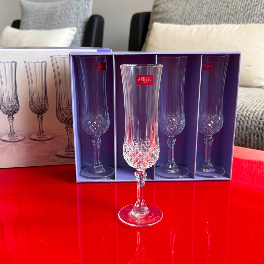 Crystal ware Champagne Glasses 2 sets of 4 (8 total). Crystal D’aroques Paris.